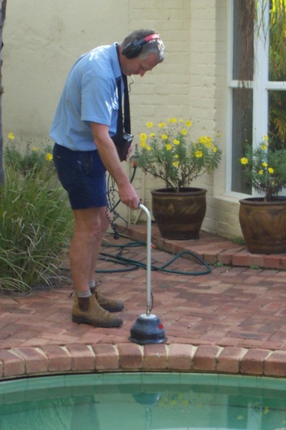 Picture: Expert Ses Steenstra, from Leak Detectives in Perth, Western Australia, searching for a leak in a swimming pool